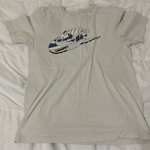 Cream Nike shirt with shoe sole nike graphic on front
